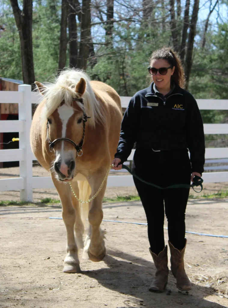 Caroline leads Unico down from the paddock during a veterans retreat