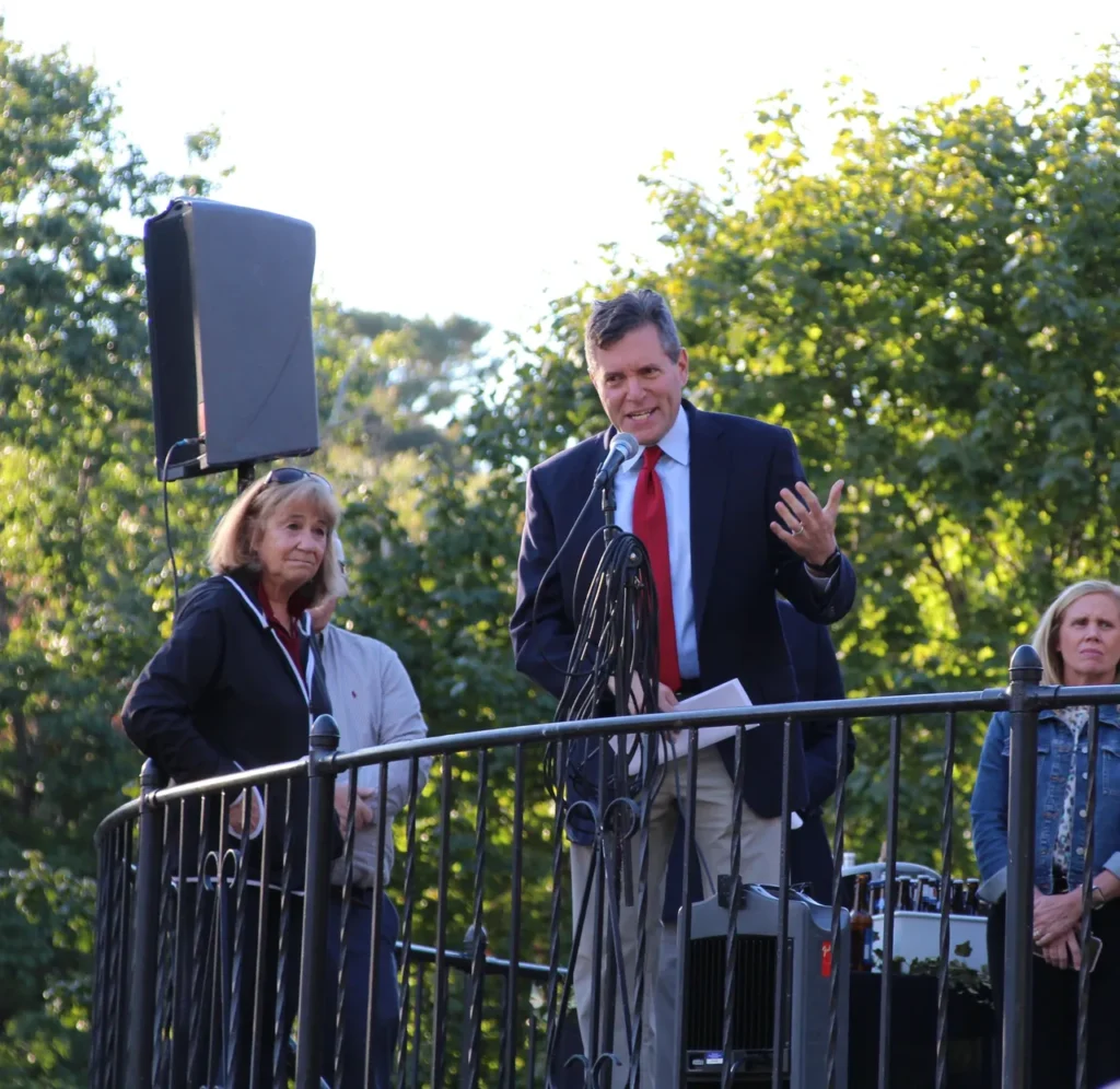 State Senator Barry Finegold speaks as Challenge Unlimited founder Deedee O'Brien looks on