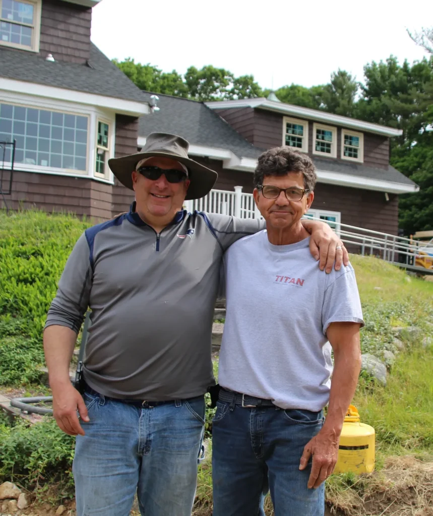 Jason Kelsey (left) and Gary Milone (right) take a break for a photo while working at the Retreat Center